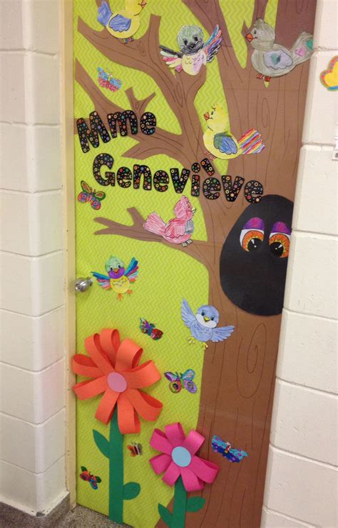 A Door Decorated With Paper Flowers Birds And A Tree That Says Nmm Geneva