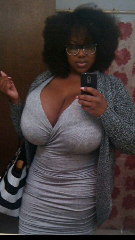 woman on the go pauses to record cleavage in a mirror for her admirers bt beautiful black