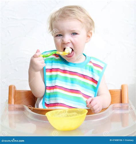 Baby Eating Porridge From Bowl Stock Photo Image Of Hand Childhood