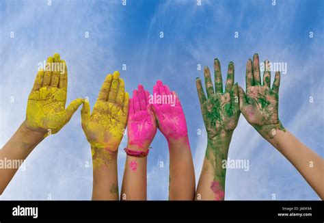Hands Palms Of Young People Covered In Pink Yellow Green Holi