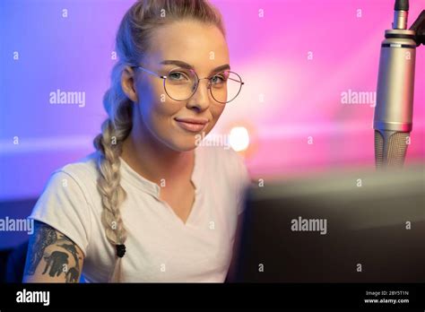 Portrait Of Blonde Gamer Girl With Glasses Playing Online Video Game On