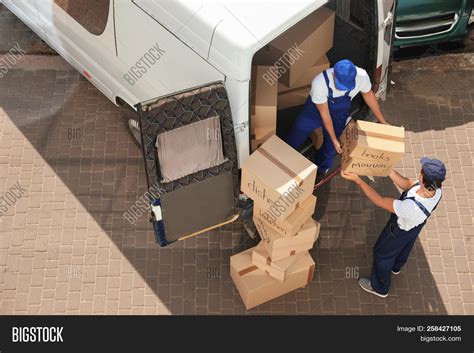 Male Movers Unloading Image And Photo Free Trial Bigstock
