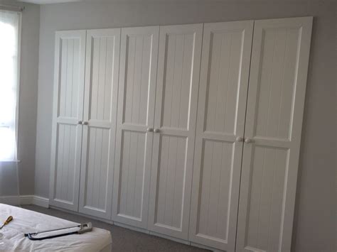 Sliding wardrobe doors don't take any space to open, but they do add modern style to a room. IKEA PAX wardrobes built into a stud wall. HURDAL doors ...