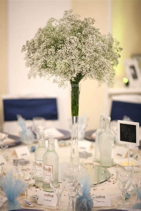 Tall Slim Lily Vases Filled With Gypsophila On The Tables Wedding