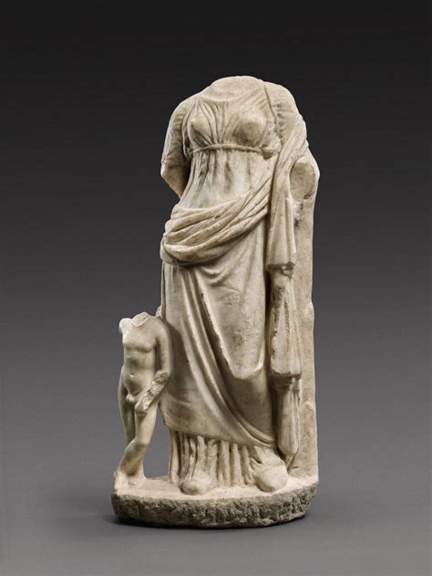 A Greek Marble Figure Of Aphrodite With Eros Late 4th Century Bc