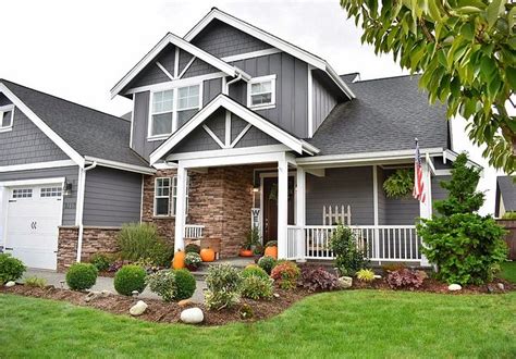 When talking about this gray paint, there are several important things you need to know. Home exterior paint color is "Grey Tabby" by Glidden | Gray house exterior, Stone front house ...
