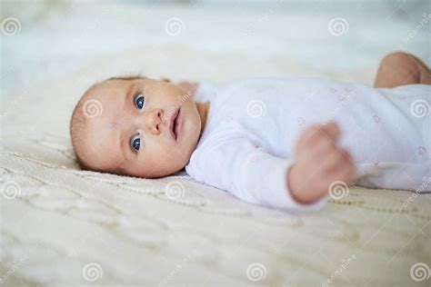 Baby Girl Lying On Bed In Nursery Stock Image Image Of Newborn Plaid