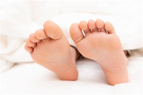 Feet Of A Boy Lying On Bed Stock Image Image Of Cute 124954273