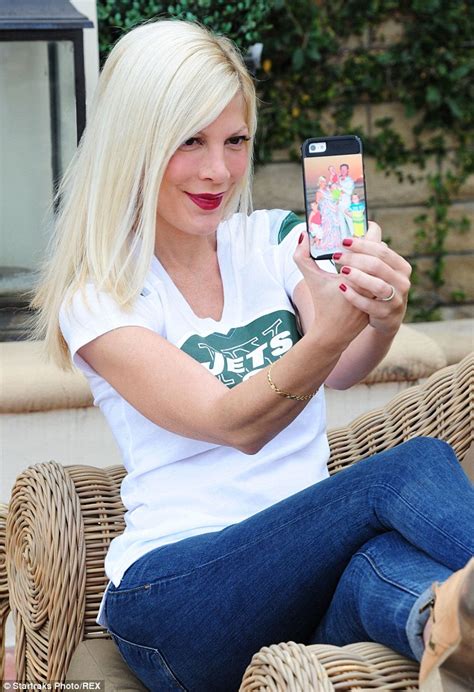 Tori Spelling Flashes Wedding Ring And Family Portrait Phone Cover