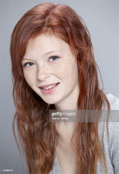 Smiling Teen Girl With Red Hair And Freckles Photo Getty Images