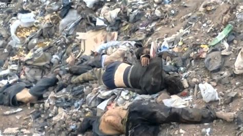 Warning Graphic Dead Bodies Lay In A Pile Of Rubbish Like Trash In