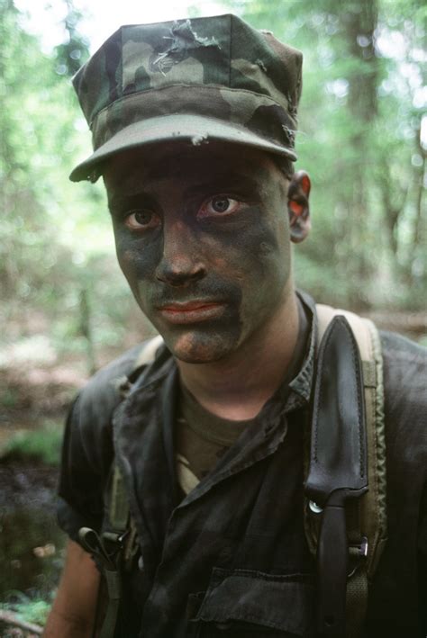 Check spelling or type a new query. A Marine wearing camouflage face paint participates in ...