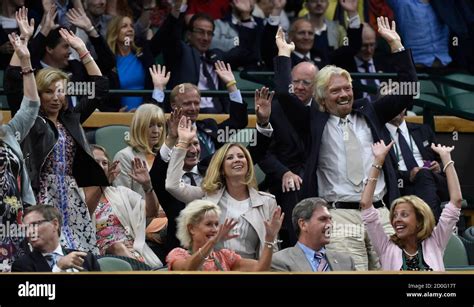 Entrepreneur Richard Branson R And Other Spectators Perform A Mexican