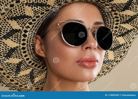 Beautiful Young Woman Wearing Sunglasses And Hat On Background Closeup