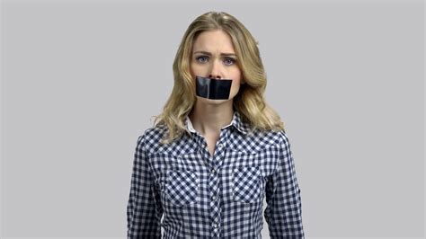 Portrait Of Sad Young Woman Cant Speak Because Of Her Mouth Taped
