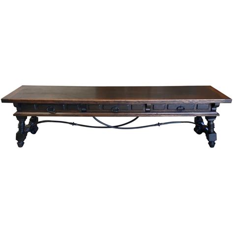Featuring 1 bulky drawer, 2 long shelves, and a wide table desk, this sofa table offers you ample storage and display areas. Long Low Table in Red Horsehair Upholstery For Sale at 1stdibs