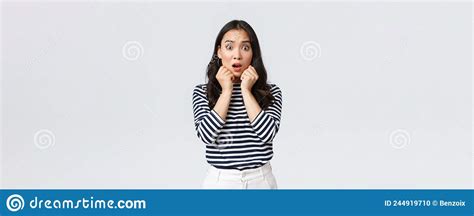 Lifestyle People Emotions And Casual Concept Scared Worried Asian Girl In Striped Shirt