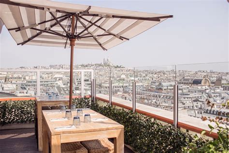 Bar With A Scenic View Over Paris Skyline On Top Of Galeries