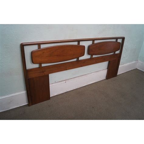 With a near to the ground design, it features a gray fabric headboard. Lane Mid-Century Modern Walnut King Size Headboard | Chairish