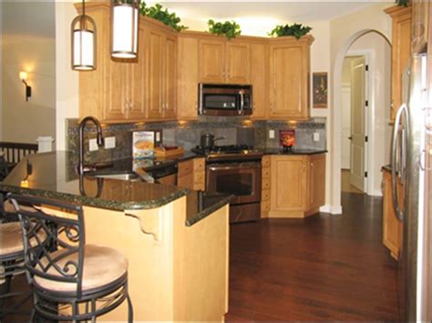 Just a step darker than trending blonde wood, warm, rich honey wood will be taking 2021 by storm. Shadow Woods Delivers | Honey oak cabinets, Light oak ...