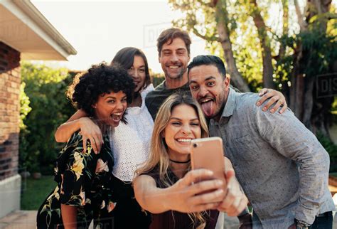 Group Of People Partying Together And Taking Selfie Young Friends At