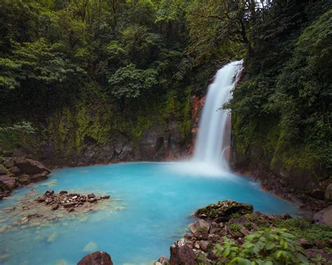 Electric Blue Waterfall In Costa Rica Rio Celeste Waterfall Rio