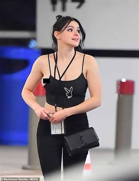 ariel winter suffers a wardrobe malfunction as she spills out of her tiny crop