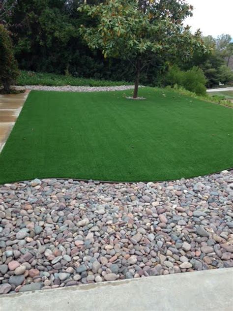 We decided to lay fake turf in our backyard from scratch. River rock and Artificial Turf combo, serenity! | Landscaping with rocks, River rock landscaping ...