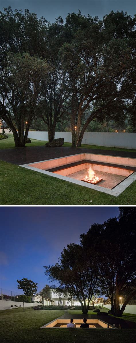 This Large And Landscaped Backyard Has A Sunken Lounge And Firepit