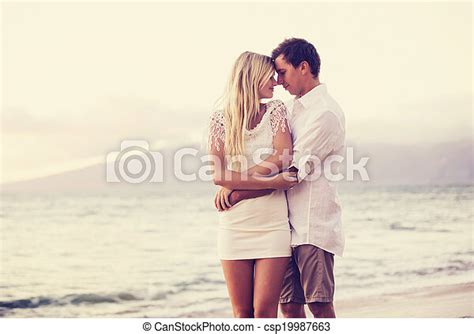 Couple On The Beach Sunset Romantic Couple In Love On The Beach At