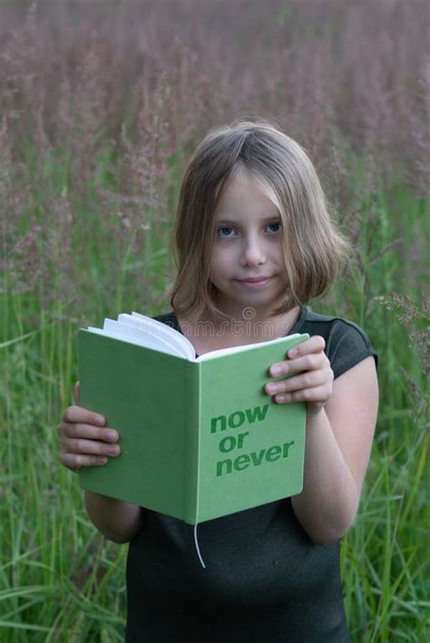 Little Girl Is Reading A Book Outside Stock Image Image Of Reading