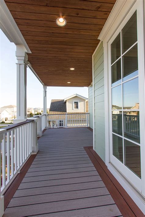 Front exterior & front yard. Beach Home #129 Cedar Stained Porch Ceilings and Fiberon ...