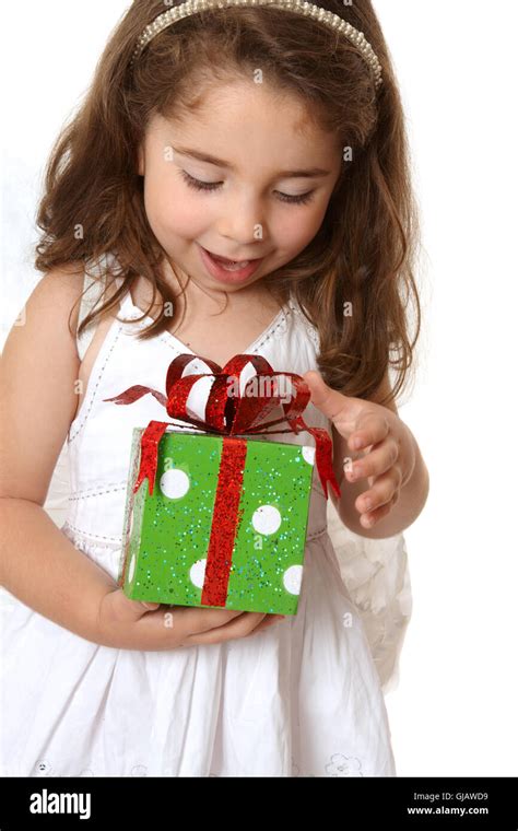 Little Girl With A Christmas Or Other Present Stock Photo Alamy