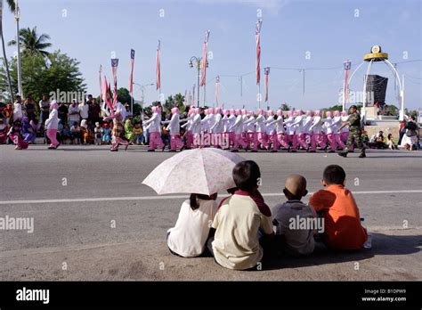 Children Watching A Parade Celebrating Malaysias 50th Independence Day