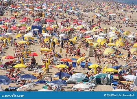 Crowded Beach And People In The Sea Waves Editorial Image