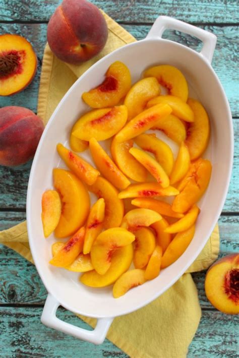 Sprinkle the dry cake mix over the peaches, evenly coating from one end to the other and all the way to the sides. Cake Mix Peach Cobbler | The BEST Peach Cobbler with Cake Mix recipe!