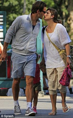Help us build our profile of roger federer! Roger Federer puckers up to his wife as they stroll around ...