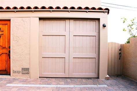 A contrasting trim color will create the look of depth around the door. Paint Grade Custom Garage Doors | Garage Doors Unlimited