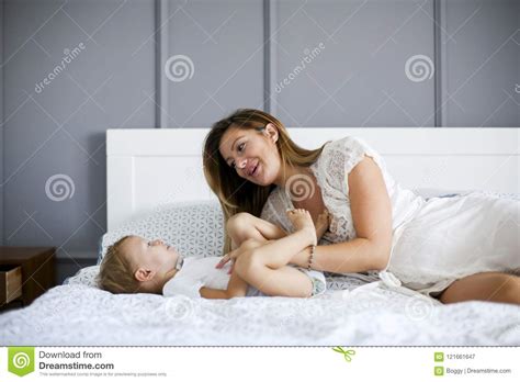 Young Mother With Son In The Bed Stock Image Image Of Indoor Laugh