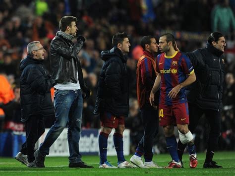 Suspended Barcelona Player Gerard Pique Nd L Stands On The Pitch During The UEFA Champions