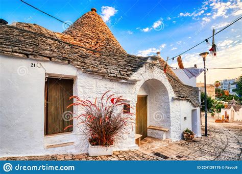 Famous Trulli Houses During A Sunny Day With Bright Blue Sky In