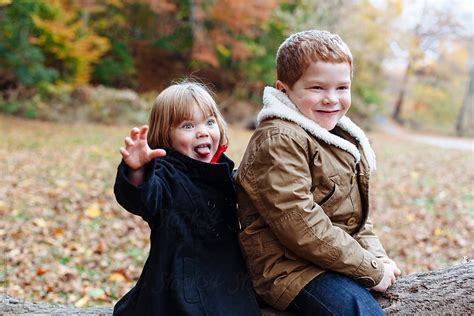 Redhead Siblings Make Funny Faces On An Autumn Day By Holly Clark
