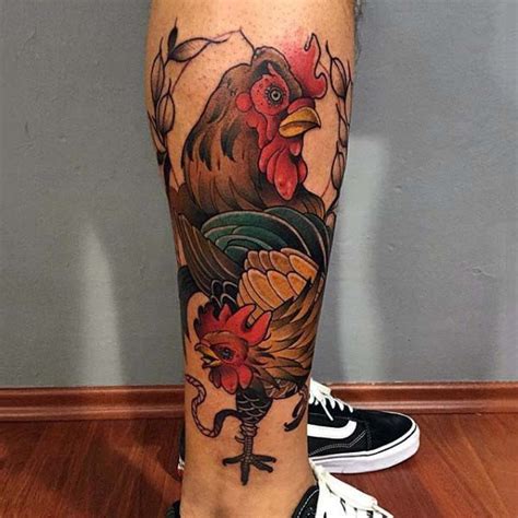 Accurate Designed Colored Cock Fight Tattoo On Leg Tattooimagesbiz