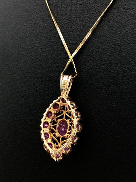 Maybe you would like to learn more about one of these? Lot - 14K Gold Ruby Pendant Necklace