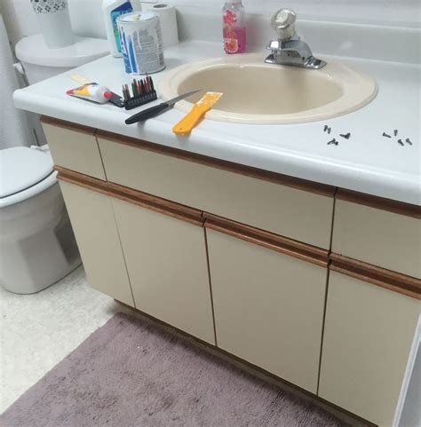 Considering most vanity units are installed in the home during initial construction, trying to get them out is not easy. Bathroom Update + How to Paint Laminate Cabinets ...