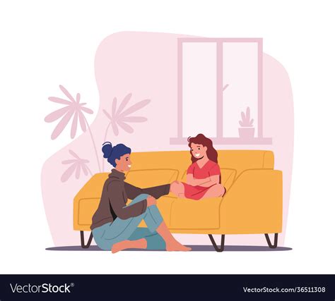 mother and daughter sitting on sofa in living room
