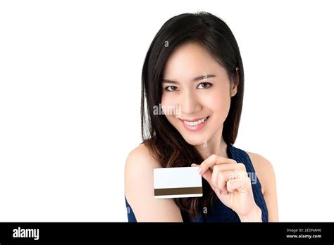 Young Smiling Beautiful Asian Woman Presenting Credit Card In Hand