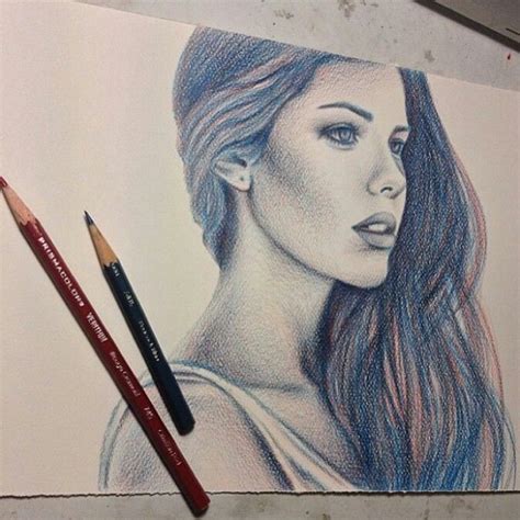 A Pencil Drawing Of A Womans Face With Long Hair And Two Different