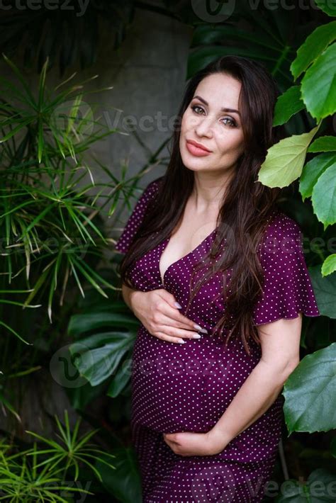 beautiful pregnant woman feels great in beautiful dress with long flowing hair 5754219 stock