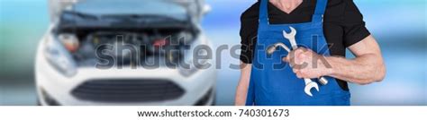 Car Mechanic Holding Wrenches Car Engine Stock Photo 740301673